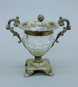 A Continental silver mounted cut glass bon bon dish. 23 cm high.