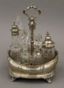 A Victorian silver cruet stand containing some original bottles. 26.5 cm high.