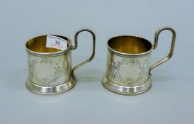 A pair of Russian silver tankards. 9 cm high. 270 grammes.