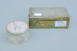 A silver cigarette box and an Indian silver box.