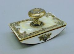 A Victorian unmarked silver mounted mother-of pearl blotter. 9.5 cm long.