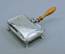 A silver silent butler. 10 cm wide. 133.4 grammes total weight.