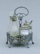 A silver cruet stand. 14 cm high.