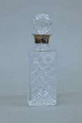 A silver rim decanter, hallmarked for Birmingham 1987, makers mark JB Chatterley & Sons. 27 cm high.