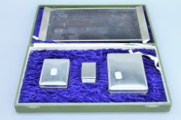 A Mitsukoshi of Japan silver and silver mounted smokers set, housed in a plush lined case.