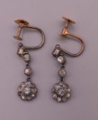 A pair of 9 ct gold mounted drop screw fix earrings. 1.5 cm high.