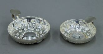 A small French silver wine taster (Augis-Lyon) and a larger French silver plated wine taster.