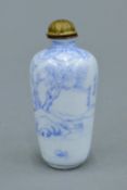 A Chinese blue and white enamel snuff bottle, signed. 6.5 cm high.