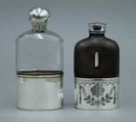 A silver topped cut glass spirit flask,