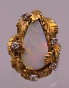 An 18 ct gold abstract opal and diamond ring. Ring size N/O (with sizer). 13.9 grammes total weight.
