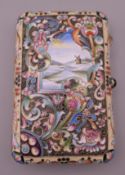 A Russian silver enamel decorated cigarette case. 10 cm high.