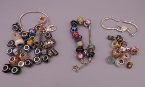 Three charm bracelets.