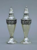 A pair of 925 silver castors. 13.5 cm high. 116.3 grammes.