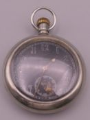 A silver plated military pocket watch. 5.5 cm diameter.