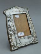 An Art Nouveau silver plated photograph frame,