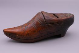 A Dutch treen box formed as a clog. 13 cm long.