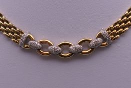 An 18 ct gold diamond necklace. 42 cm long. 68.2 grammes total weight.