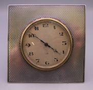 A silver mounted desk clock, hallmarked Adie Brothers Ltd, Birmingham 1926. 8 cm high.