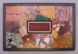 An Italian pietra dura paperweight, inscribed Roma. 12 cm wide.