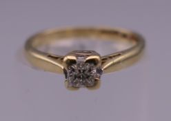 A gold diamond solitaire ring. Ring size H.