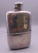 A silver spirit flask. 16 cm high. 308.2 grammes.