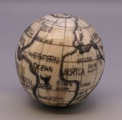 A bone globe compass. 6.5 cm high.