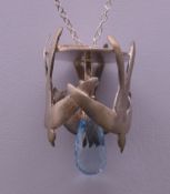 A boxed Phoenix tree silver pendant on chain. The pendant 3.5 cm high.