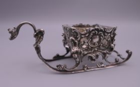A Continental 800 silver sledge shape salt, with original glass liner. 9.5 cm long.