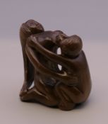 An erotic netsuke. 4.25 cm high.