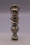 A figural seal bearing Russian marks. 8 cm high.