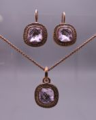 A boxed Thomas Sabo pendant and matching earrings.