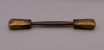 A Japanese lacquered hair pin. 16 cm long.