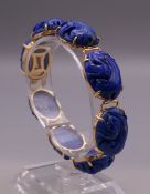 A 14 ct gold and lapiz bracelet. 17 cm long. 32.5 grammes total weight.