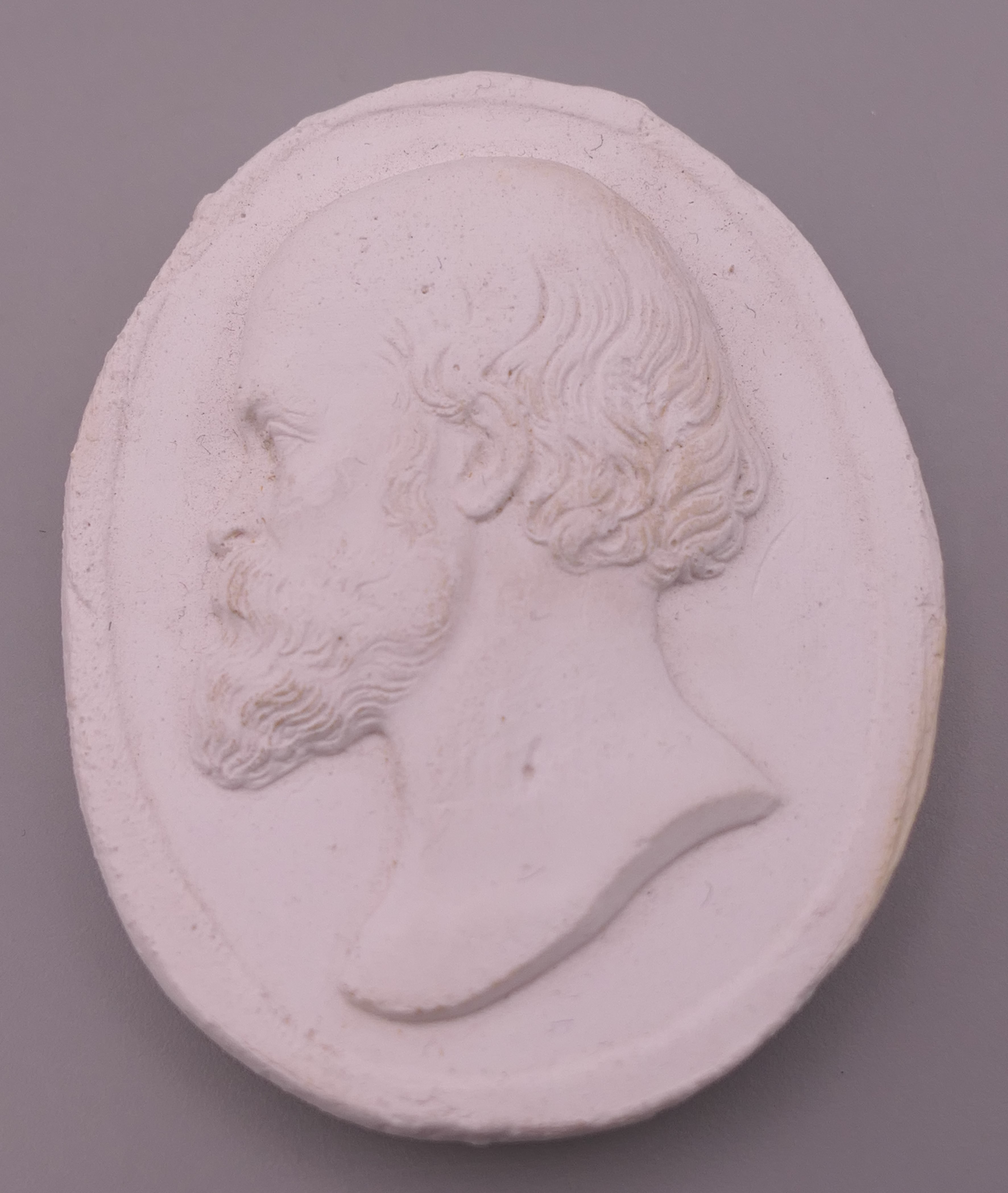 A boxed plaster intaglio depicting a bearded gentleman. 5.5 cm x 4.5 cm. - Image 2 of 5
