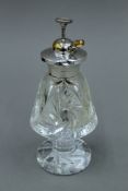A silver topped cut glass atomiser. 15 cm high.