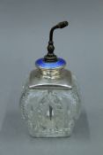 A sterling silver and blue enamel top cut glass atomiser. 15 cm high overall.