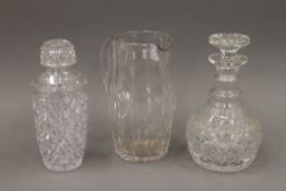 A cut glass cocktail shaker, a decanter and a lemonade jug. The latter 21.5 cm high.