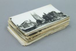 A quantity of various postcards.