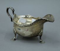 A silver sauce boat. 18 cm long. 242.3 grammes.