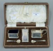A Walker & Hall cased silver cruet set (lacking one liner). 183.7 grammes.