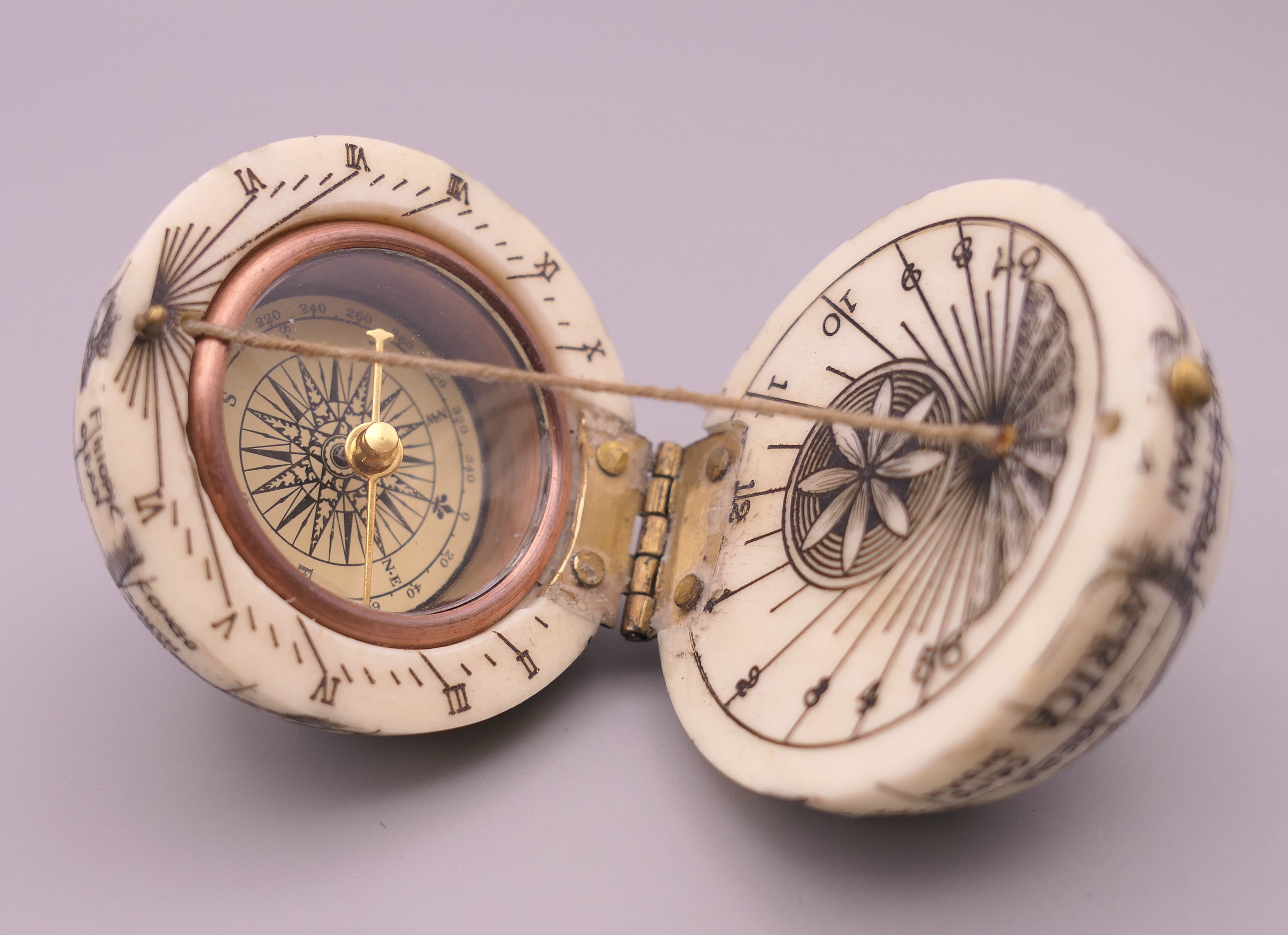 A bone globe compass. 4 cm diameter.