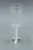 An 18th/19th century etched air twist stem glass. 17.5 cm high.