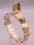 A Patek Philippe ladies wristwatch housed in 18 ct gold case on a 14 ct bi-colour gold strap. 1.