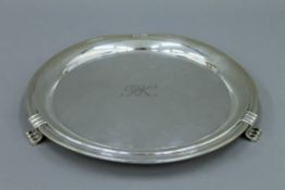 A silver salver. 25 cm diameter. 347.8 grammes.