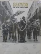 A signed Olympia brass band of New Orleans poster, glazed. 43 x 55.5 cm.