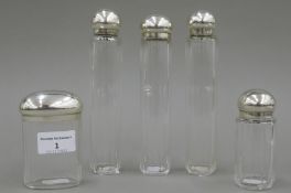 Five cut glass and silver topped Asprey and Co jars, hallmarked for London 1880,