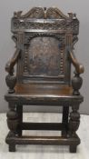 17thC English jointed oak wainscot chair with carved double scroll pediment, turned finials and