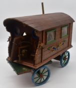 Scratch built wooden model of a traditional gypsy caravan with ornate decoration, 57cm x 43cm