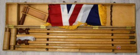 A bespoke cased sectional flagpole with Union Jack flag and a vintage football rattle