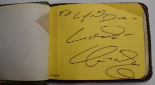Autograph album containing signatures including Neil Sedaka, Les Dennis, Heinz, Mike Reid, Gene
